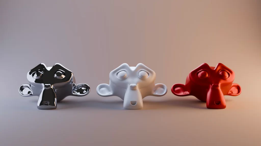 Aprende 3D online 16 Tres cabezas Suzanne con materiales metal, clay y plástico en iluminación de estudio